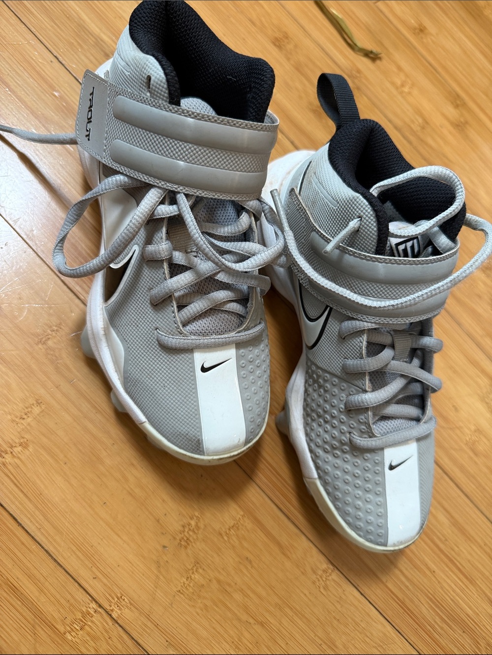 Nike Kids Gray and White trout cleats size 1